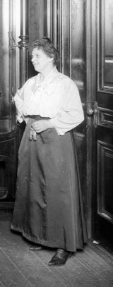 Housekeeper in the early 1900s holding keychain