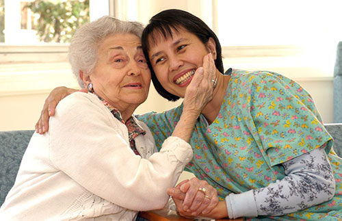 resident and nurse in caring embrace