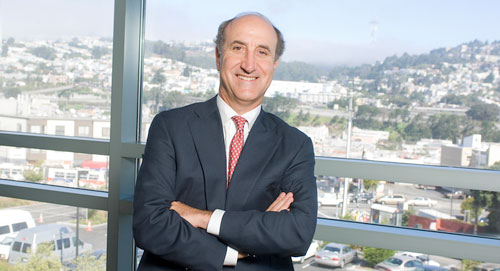 Mark Myers standing in front of window overlooking San Francisco at the Jewish Home