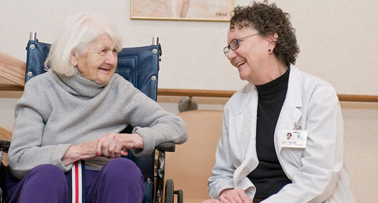 Patient and caregiver in rehab center