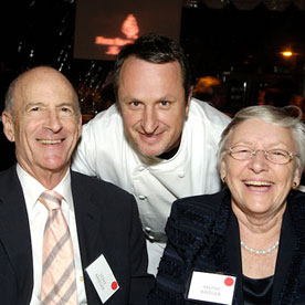 Chef and couple smiling