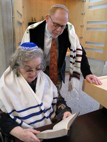 Rebekah Finer and Rabbi Marder in the synagogue
