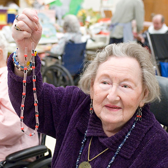 Marian Blechman showing a jewelry creation