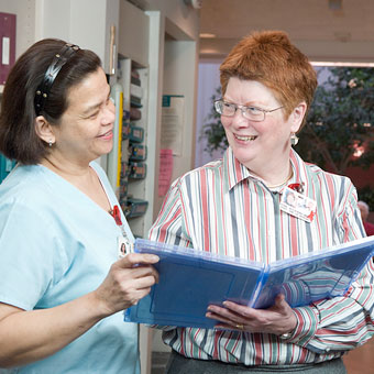 Nurses at the Jewish Home discuss a resident