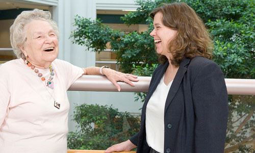 Staff and patient laughing and socializing in the STARS unit atrium